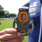 The Outlaw Triathlon Medal