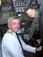 Vice Admiral Philip Jones CB, Fleet Commander with Lt Tom Hougham in the Merlin Mark cockpit