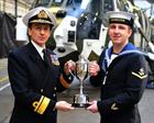 Leading Aircrewman Kieran Lovett presented wit best overall student award by R Adm Russ Harding