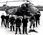 The duty Search and Rescue crew of a 771 NAS Wessex Mk5 pose in front of their helicopter in 1980