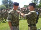 AET Alex Fisher being awarded the Queens Medal by Rear Admiral Paul Bennett OBE, COS JFC