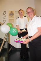 PO Lorry Osman, organiser of the Sea King Force Bake-Off ably assisted by AET Hollie Hill