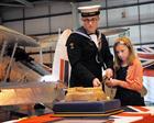 Air Engineering Technician (AET) Adam Geddes (19) Isabelle Mitchell (aged 10) cut the cake.