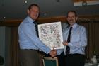 Commanding Officer of 750 Naval Air Squadron Lt Cdr Whitson-Fay presenting Lt Cdr Danny Daniell with