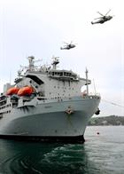 820 NAS Merlins fly over RFA Argus in Falmouth