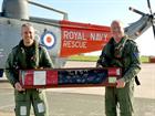 RAdml Keith Blount [Left] hands over the signed Sea King tail rotor leaving gift to WOACMN Ian ‘Zipp