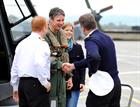 Flt Cdr Lt Dave Neyland and Wife Lizzy are welcomed back by Commodore (Cdre)  Jon Pentreath and Comm