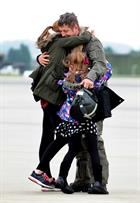 CPO Steve Wilson greets children Lauren (14) and Nat (7) after arriving back to 815 Naval Air Squadr