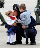 LAET Gav Babb kisses daughter Amie (2) after returning home to 815 Naval Air Squadron at RNAS Yeovil