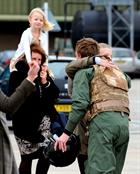 Lieutenant Max Cosby meets family members after returning to 815 Naval Air Squadron at RNAS Yeovilto