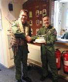 Lt Cdr Steve Hayton (left) receiving his 3000 hrs cake from Lt Cdr Iain Macfarlane 