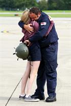 Chief Petty Officer Jim Wilkins hugs daughter Phoebe Wilkins (13)
