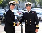 Commodore Jeremy Kyd (left) greets Commodore Andrew Betton OBE outside Victory Building prior to the