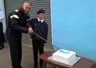 R. Admiral Blount & Junior Cadet Gilder Cutting the Cake