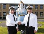 L- R Commodore Jon Pentreath hands over the reigns as Commanding Officer at RNAS Yeovilton to Commod
