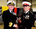 Admiral Cunningham CBE presents Capt Barnwell RM with his Campaign Service Medal (Afghanistan)