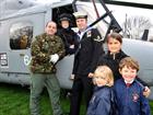 Lt Cdr Alex Sims and LET Marshall with children from St Alban's Primary School