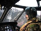 Sub Lt Dan Howes pilots his helicopter in the challenging terrain