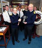 Captain Willy Entwisle receives  Bambara Flight Safety Trophy from R.Adm Russ Harding
