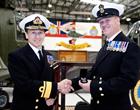 Admiral Harding presents medal to CPO Air Engineering Technician Russell Thompson