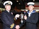 NA 2 (AH) Adam Beasley receiving trophy from Lt Cdr Peter Munro-Lott