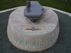 Memorial with added surround for plaques