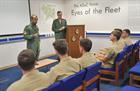 Lt Cdr Colin McGannity CO 949 NAS briefing the USN Cadets