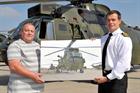 Mr Tony Byrne presenting his painting to XO 845 NAS, Lt Cdr Matthew Punch