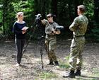 Elise prepares her team to interview Lt Gaz Plunkett with RN Videographer Caroline Davies