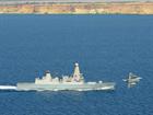 RAF Typhoon jet passes HMS Dragon off the coast of Cyprus