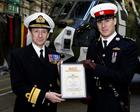 Captain James Bowerman RM receives his ‘Wings’ and certificate from Rear Admiral Russ Harding OBE
