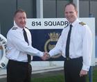 Commander Chris Stock (left) handing over command of 814 Naval Air Squadron to Commander Stuart Finn