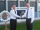 Commander Chris Stock (left) handing over command of 814 Naval Air Squadron to Commander Stuart Finn