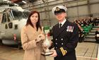 Mrs Ali Phesse presenting the John Phesse  Memorial Trophy to Lt Ross Clegg, top student on course