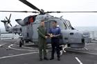 CO 700W Lt Cdr Simon Collins gives squadron crest to Dragon's Captain Ian Lower
