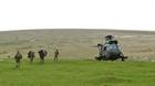Soldiers who man the Tors board a Royal Navy Sea King helicopter