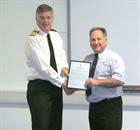 Capt Mark Garratt, Commanding Officer RNAS Culdrose presenting the Captains Award to Mr Peter Willia