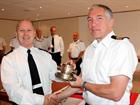 WO 1 Andy Lewis being presented with a memento of his Naval Career from Cdr John Lea