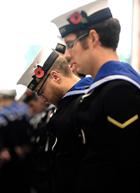 Personnel from RNAS Culdrose observing the Two Minutes Silence