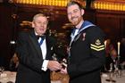 LAET Aarron Clayton receiving the Merchant Taylors’ Military Affiliates Award from Mr Peter Watkins