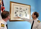 Vice Admiral David Steel CBE DL, unveils the commissioning painting alongside Lt Cdr Steve Griffin