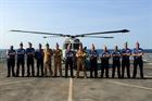 Crew of 217 Flight and the Commanding Officer of HMS Defender in front of Miss Adventure on her 35th