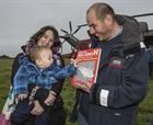 Ella, Marcus and Barney McClachlan with the Sea King book