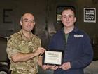 Aircraft Engineering Technician Adam Steventon (right) is presented with his award by Lieutenant Col