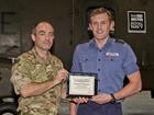 Petty Officer Aircraft Engineering Technician Ben Smith (right) is presented with his award by Lieut