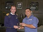Petty Officer Mellor (right) is presented with his award by Captain Niall Griffin (left)