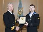 Commodore Matt Briers RN presenting Leading Aircrewman Jack Cook with his ‘Wings’.
