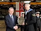 LACMN  Luke Phillips is awarded the Guy Edwards Trophy from Lord Hutton
