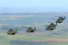 Merlin helicopters from 846 Naval Air Squadron fly in formation from Royal Air Force Base Benson to 