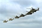 Merlin helicopters from 846 Naval Air Squadron fly in formation from Royal Air Force Base Benson to 